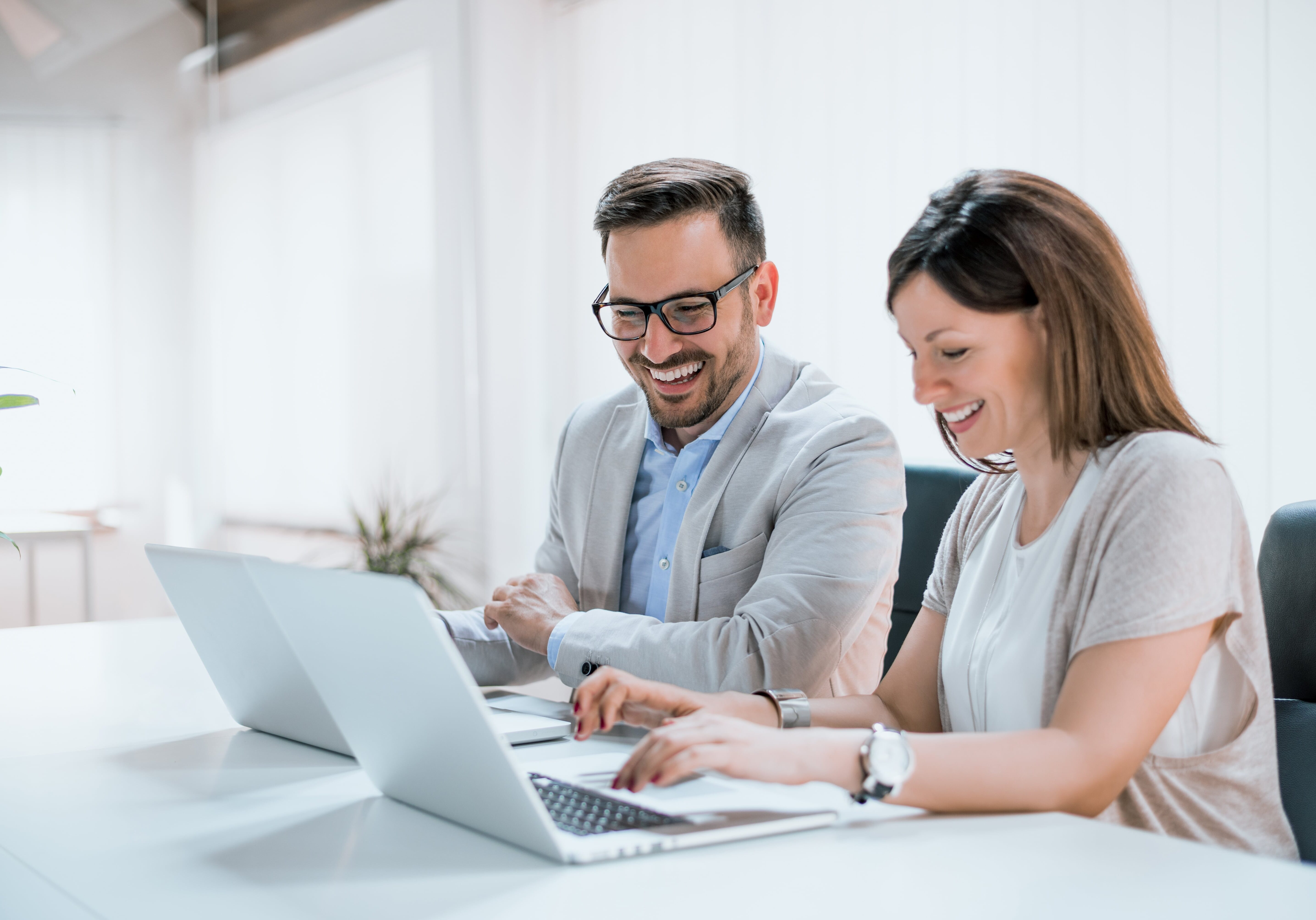 Two entrepreneurs sitting together working in an office
office, man, woman, computer, teamwork, two, young, sitting, entrepreneur, business, people, professional, happy, team, together, smiling, laptop, company, desk, adult, talking, female, caucasian, working, coworkers, entrepreneurs, colleagues, technology, table, attractive, indoors, project, partners, workplace, cheerful, success, communication, corporate