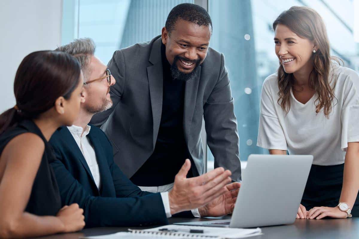 Cropped shot of a group of property managers having a meeting around the table in the boardroom discussing online reputation management