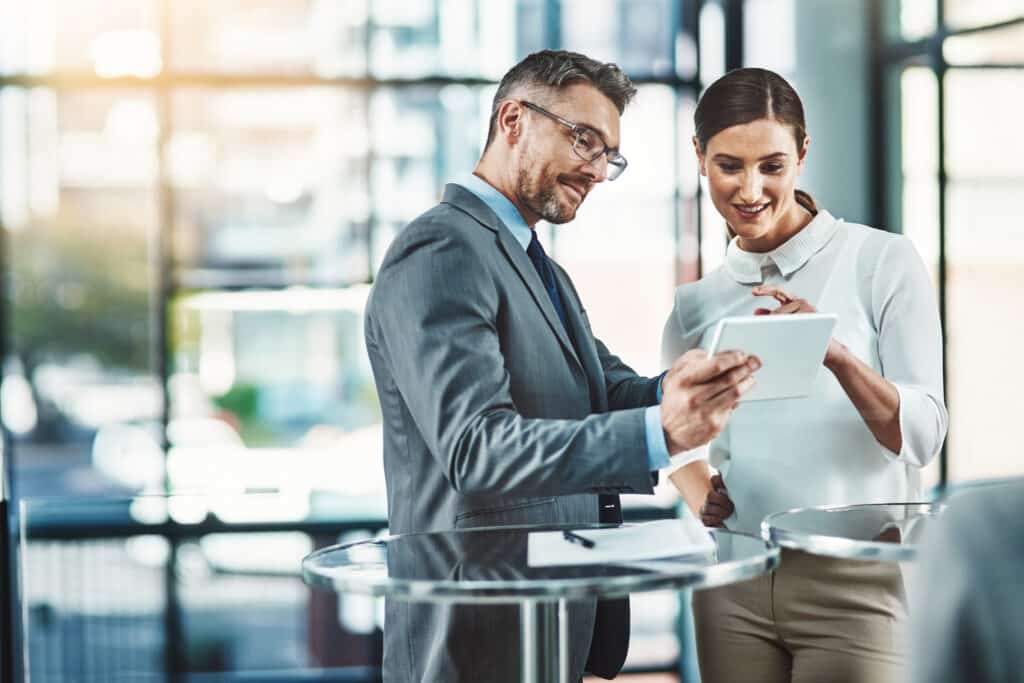 commercial real estate stakeholders taking a satisfaction survey on tablet