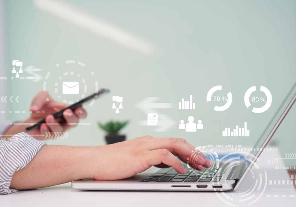 close up manager man hand typing on keyboard laptop for working report about company's profit