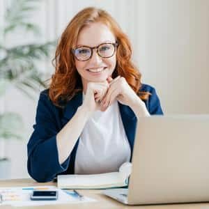 Pleased cheerful red haired multifamily marketing manager