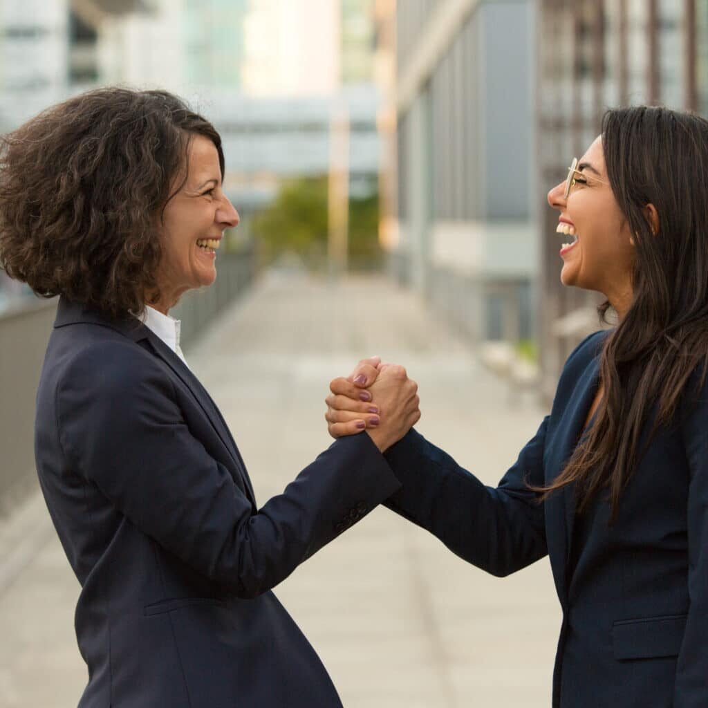 Happy excited colleagues celebrating triumph together
people, business, businesswoman, professional, leader, colleague, partner, friend, concept, portrait, woman, female, Caucasian, adult, young, Latin, middle aged, formal, suit, outside, office, building, city, street, urban, standing, giving, handshake, partnership, gesture, congratulation, cooperation, celebrating, success, joy, triumph, team, teamwork, successful, confident, happy, smiling, excited, overjoyed, laughing, friendly, side, view, two
Happy excited colleagues celebrating triumph together. Business women giving friendly handshake outside. Teamwork and success concept