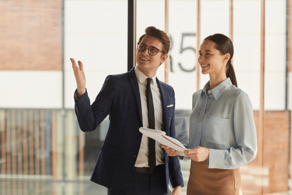 leasing agents man and woman, viewing an apartment unit