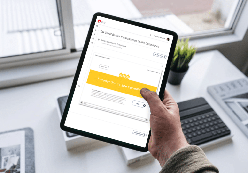 man holding ipadwith grace hill tax credit course displaying
