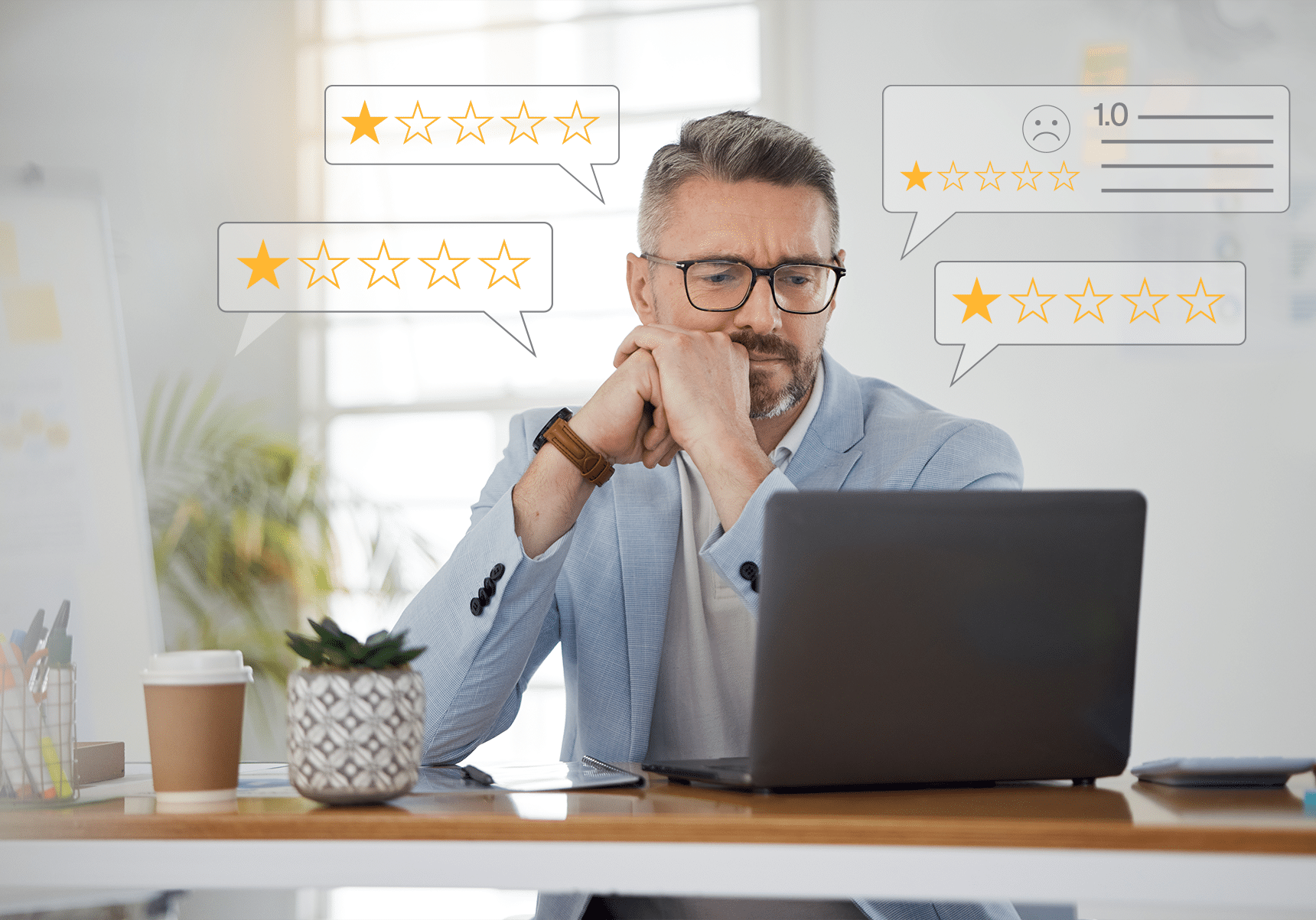 man sitting at desk disappointed with the negative online reviews his property is receiving